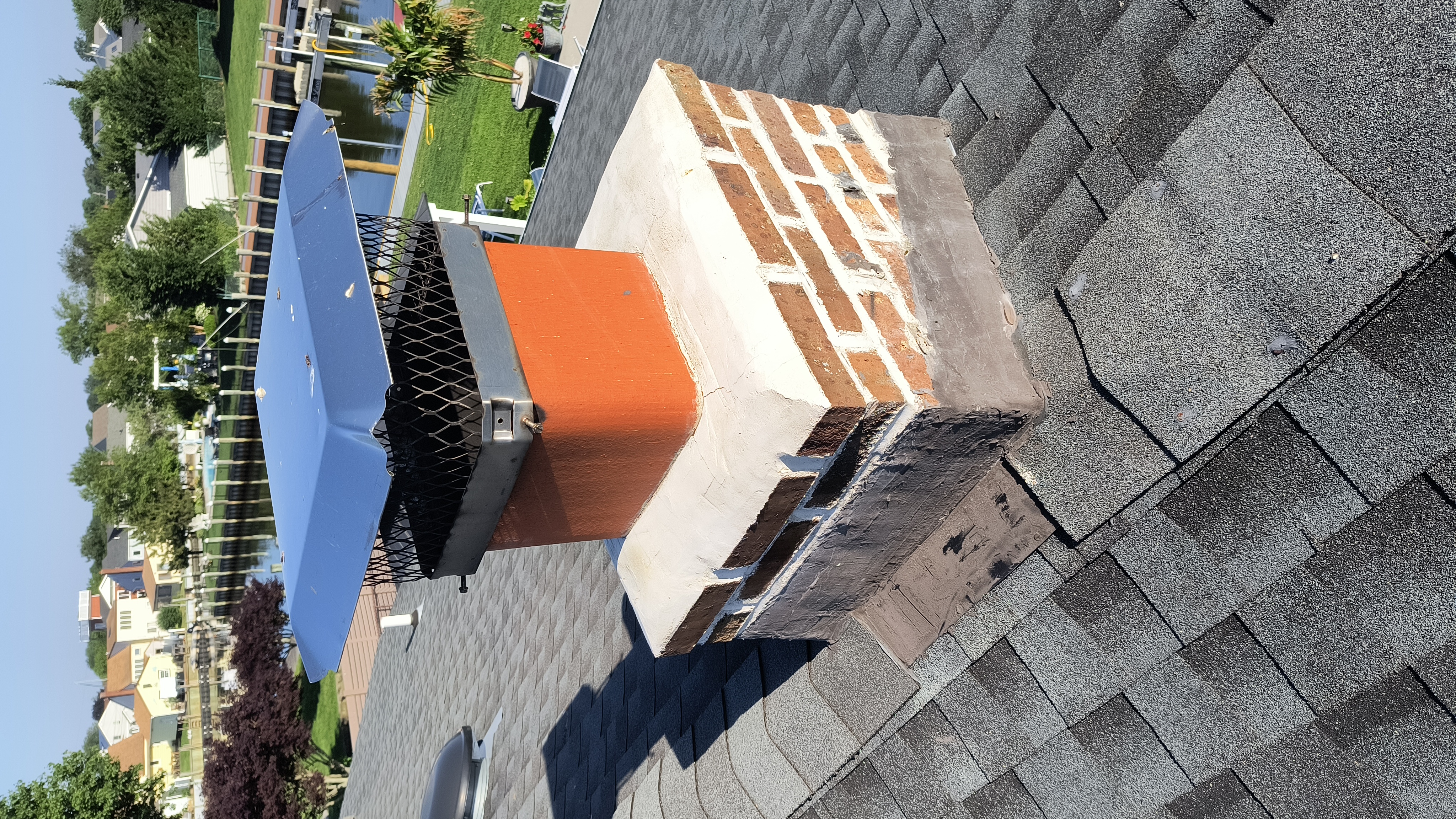 Full chimney masonry rebuild and restoration in Syosset, NY