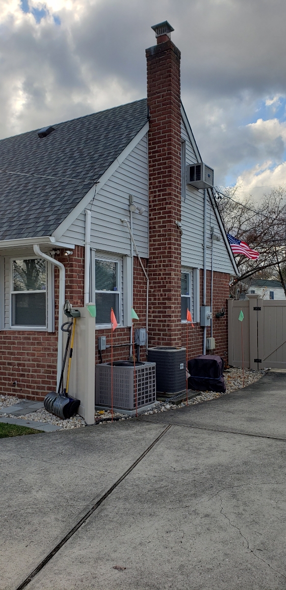 Professional chimney repointing restoring brick joints in Syosset, NY