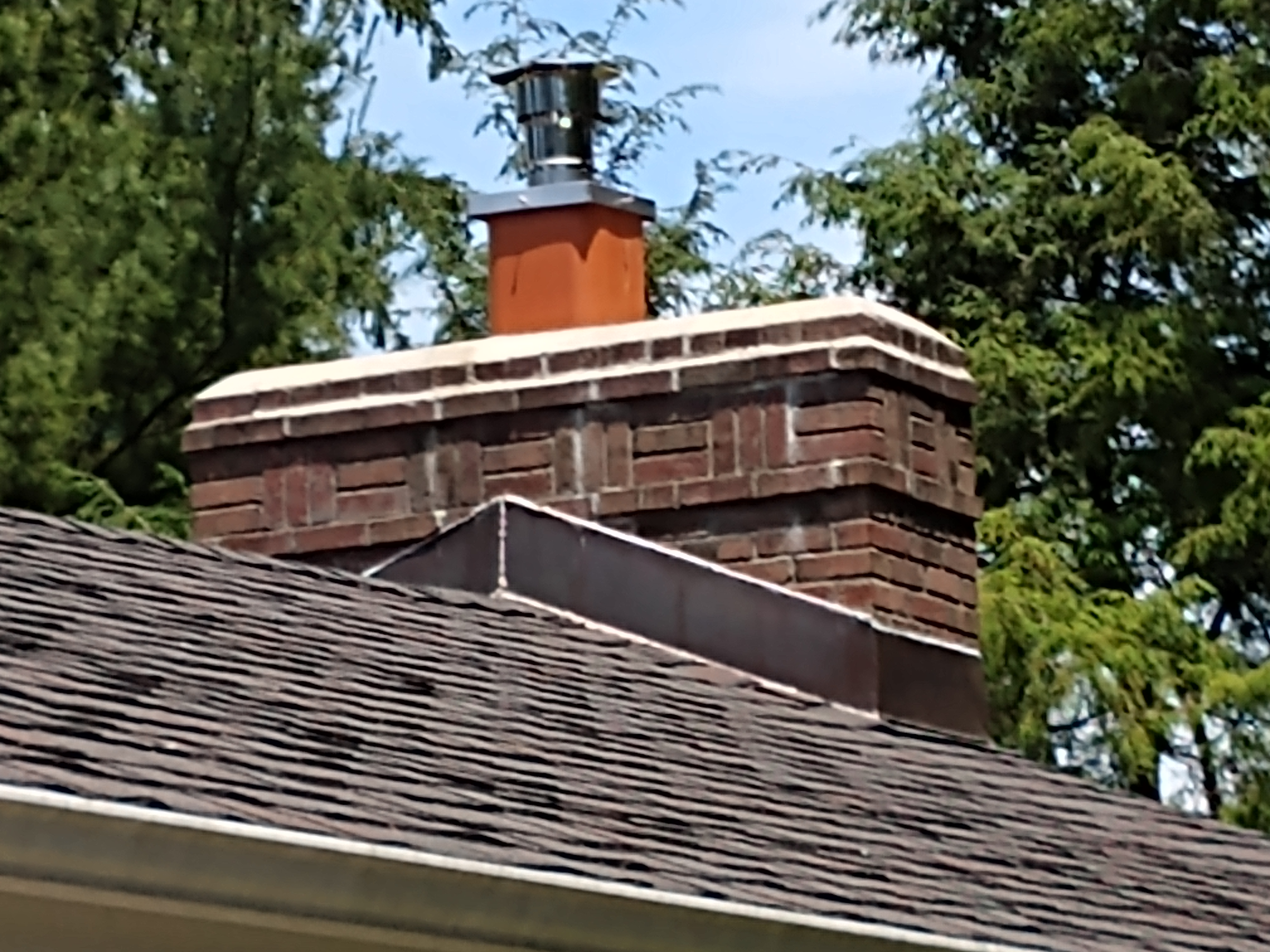 Stainless steel chimney cap with animal guard in Syosset, New York